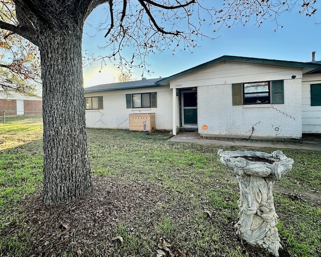 exterior space with a front lawn