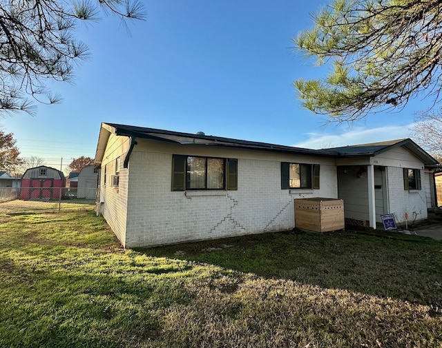 back of house featuring a yard