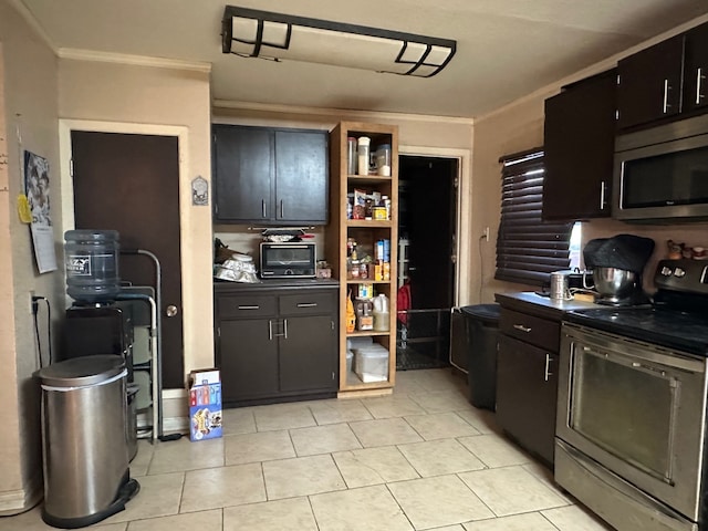 kitchen with dark brown cabinetry, light tile patterned floors, crown molding, and appliances with stainless steel finishes