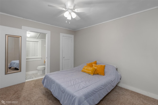 bedroom with light carpet, crown molding, ensuite bath, and ceiling fan