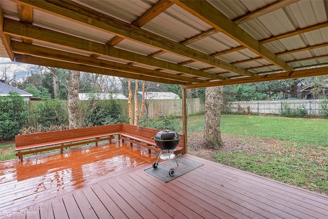 wooden terrace with a lawn