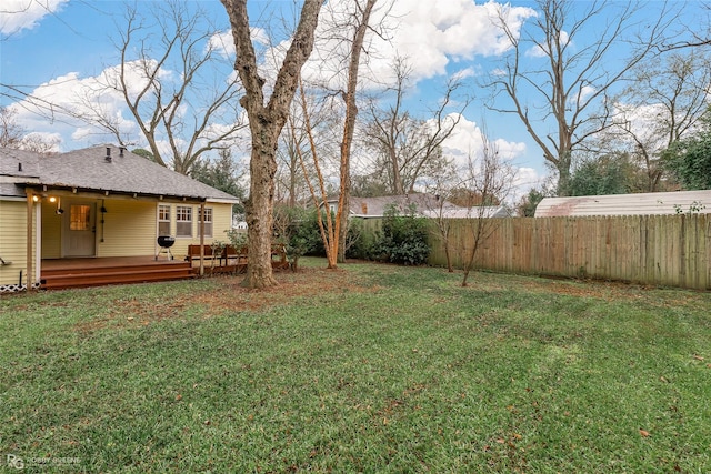 view of yard featuring a wooden deck