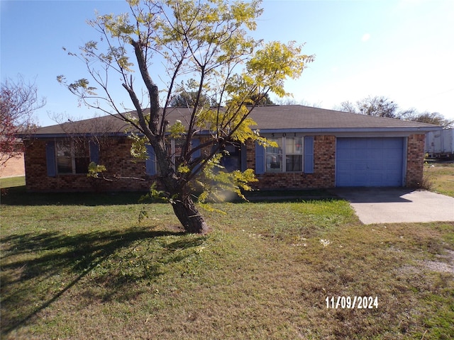 single story home with a front lawn and a garage