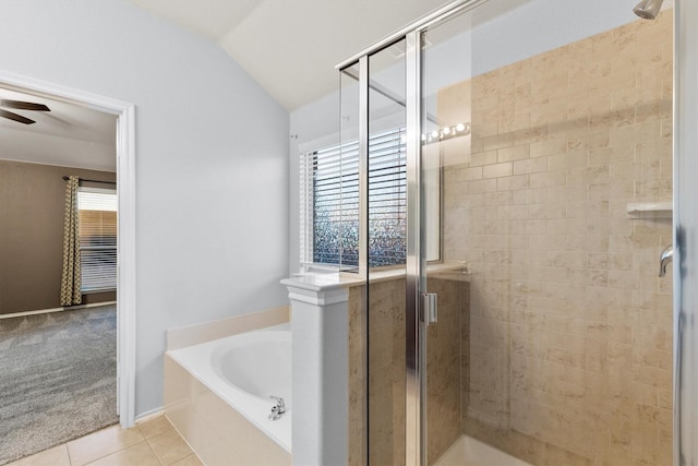 bathroom featuring tile patterned flooring, ceiling fan, separate shower and tub, and lofted ceiling