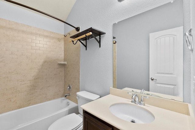 full bathroom with vanity, toilet, and tiled shower / bath