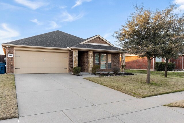 view of front facade with a front lawn and a garage