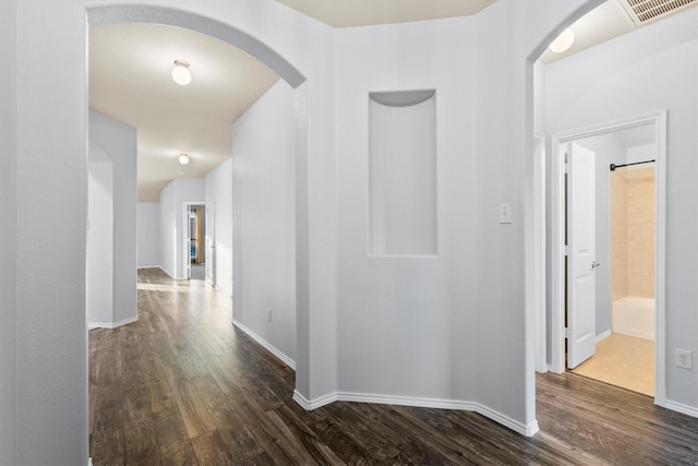 hallway featuring dark hardwood / wood-style floors