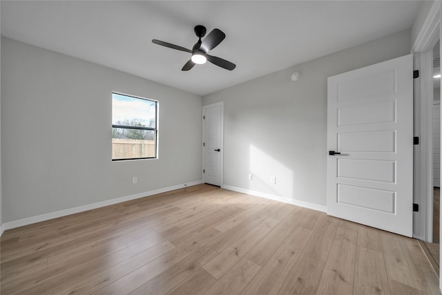 spare room featuring ceiling fan and light wood-type flooring