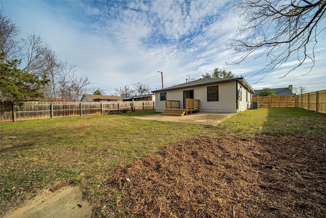 view of yard with a patio and central AC unit