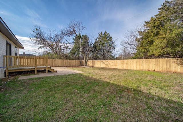 view of yard featuring a wooden deck