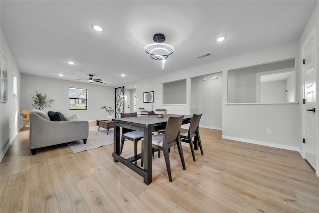 dining area featuring ceiling fan and light wood-type flooring