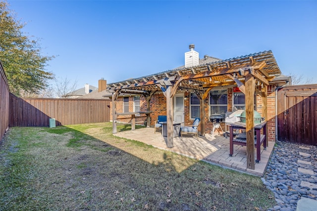 back of property featuring a pergola, a patio area, and a lawn