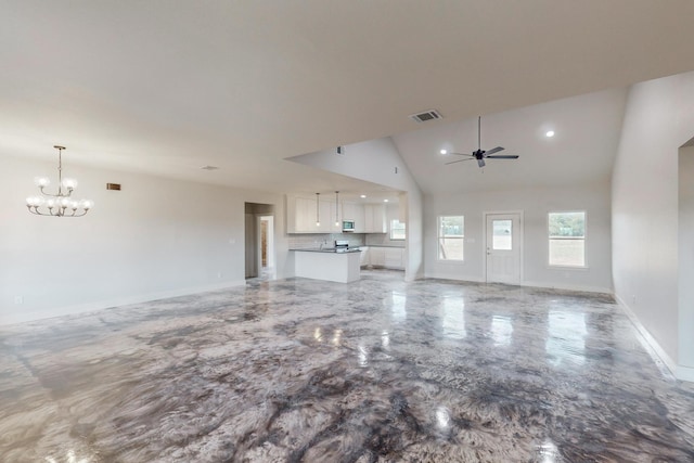 unfurnished living room featuring high vaulted ceiling and ceiling fan with notable chandelier