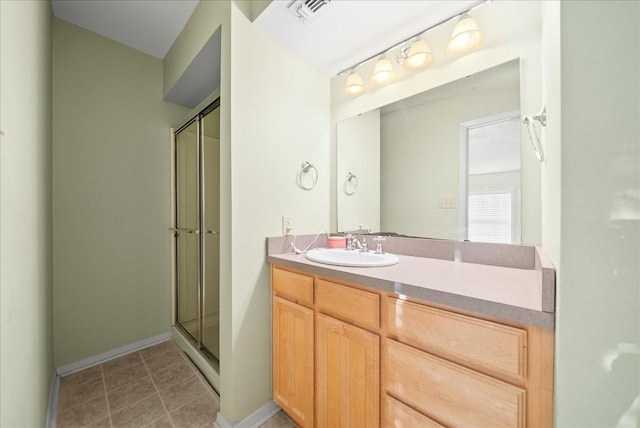 bathroom with vanity and an enclosed shower