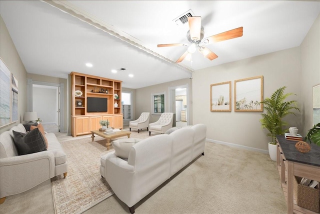 living room with ceiling fan and light carpet