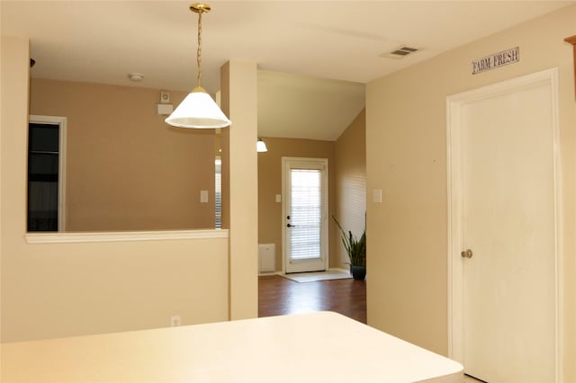 unfurnished dining area featuring dark hardwood / wood-style floors