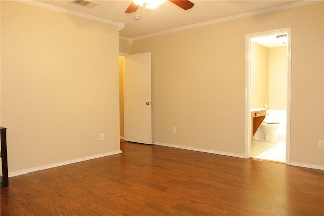 spare room featuring ceiling fan, dark hardwood / wood-style flooring, and ornamental molding