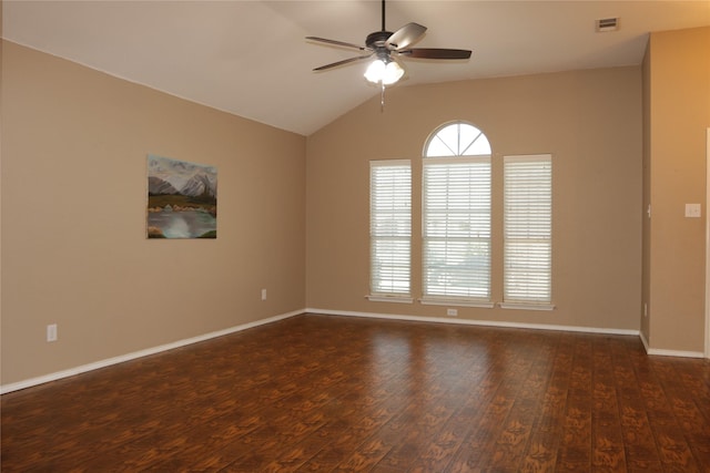 empty room featuring lofted ceiling, dark wood-type flooring, and ceiling fan