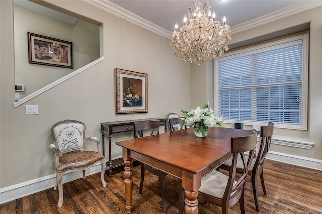 dining space featuring crown molding, dark hardwood / wood-style floors, and an inviting chandelier