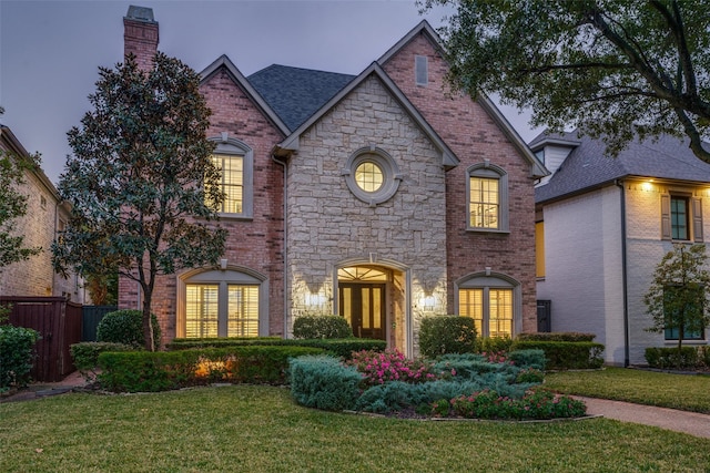 view of front of house with a lawn