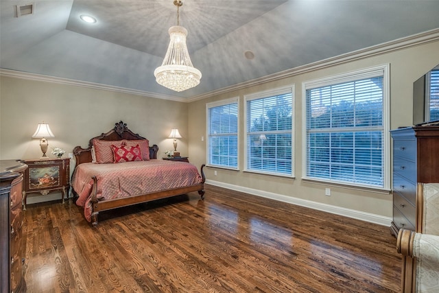 bedroom with crown molding, dark hardwood / wood-style floors, a raised ceiling, and a chandelier