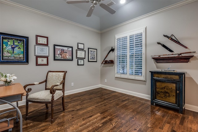 sitting room with lofted ceiling, dark wood-type flooring, ornamental molding, and ceiling fan