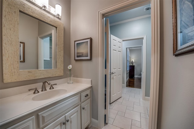 bathroom featuring vanity and crown molding