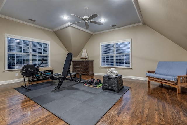 exercise area featuring lofted ceiling, crown molding, dark hardwood / wood-style floors, and ceiling fan