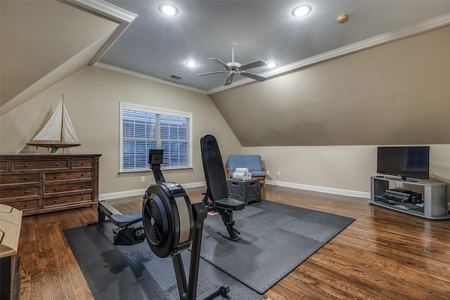 workout room featuring lofted ceiling, crown molding, dark hardwood / wood-style floors, and ceiling fan