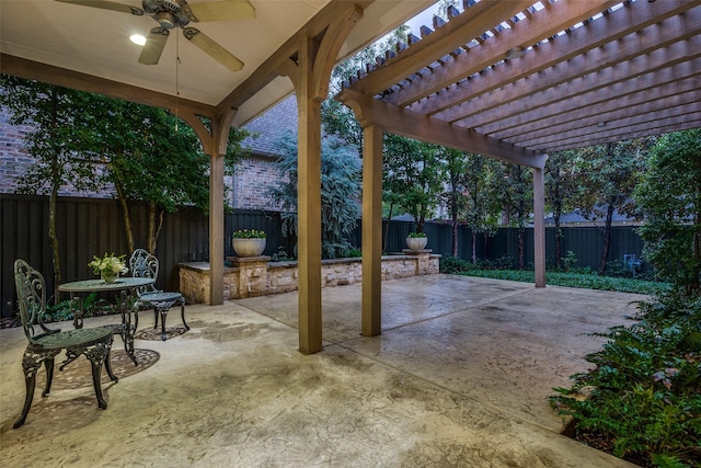 view of patio featuring ceiling fan and a pergola