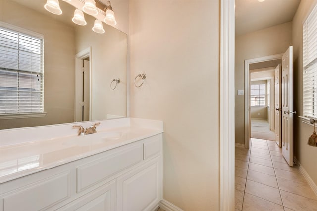 bathroom with tile patterned flooring and vanity