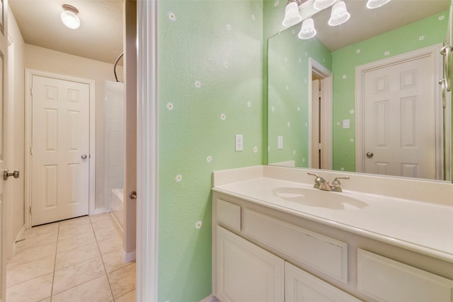 bathroom featuring tile patterned flooring, vanity, and bathtub / shower combination