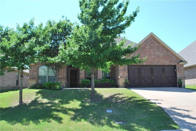 view of front of house featuring a garage and a front lawn