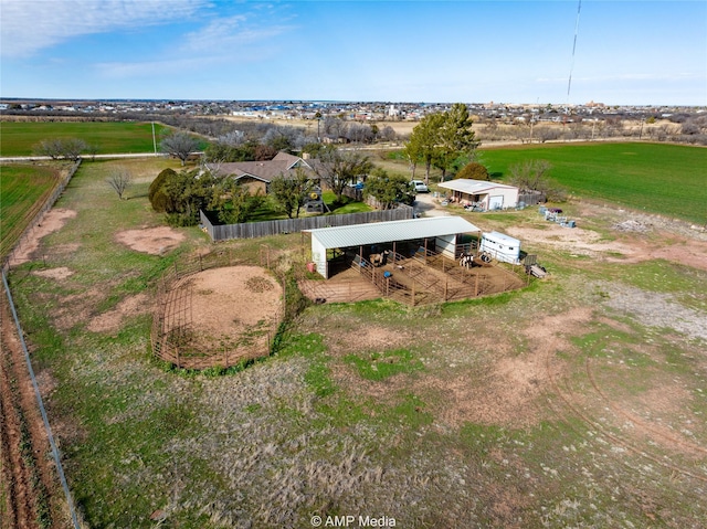 birds eye view of property with a rural view