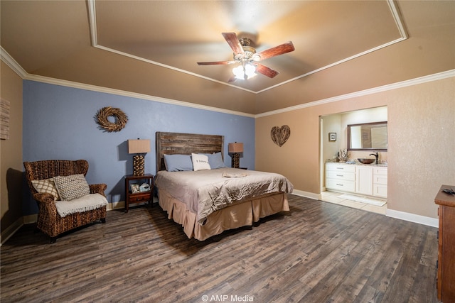 bedroom with ceiling fan, crown molding, dark hardwood / wood-style flooring, and a raised ceiling