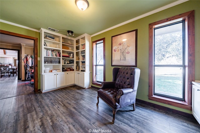 living area featuring ornamental molding and dark hardwood / wood-style floors