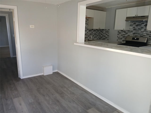 spare room with dark wood-type flooring