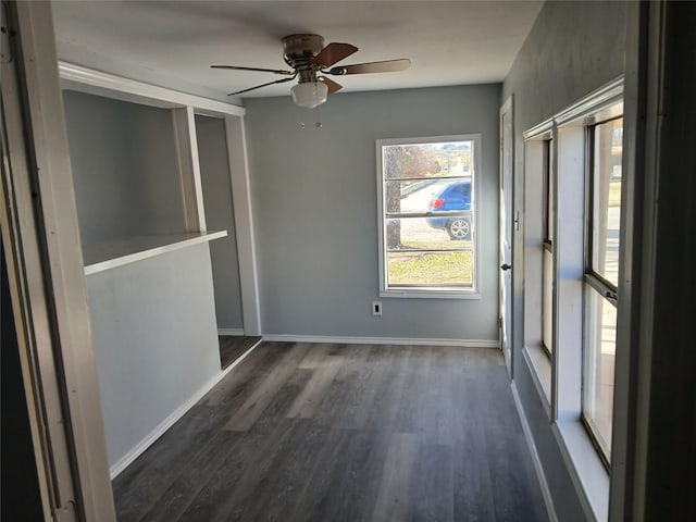 unfurnished bedroom with dark hardwood / wood-style flooring and ceiling fan