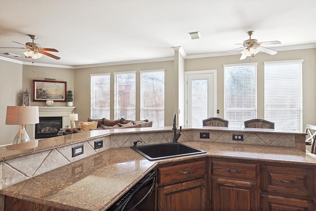 kitchen featuring dishwasher, crown molding, a wealth of natural light, and sink