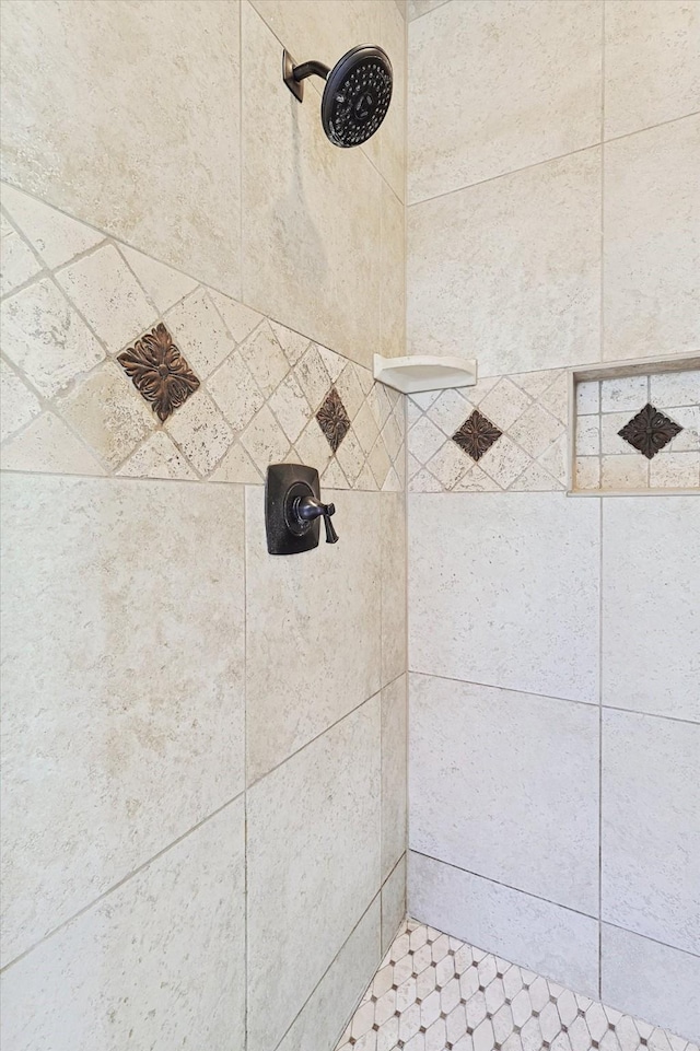 bathroom with tiled shower