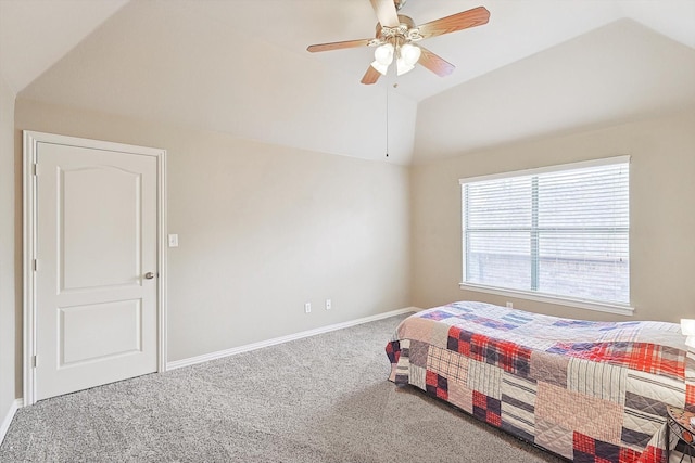 bedroom with ceiling fan, vaulted ceiling, and carpet