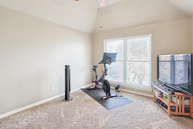 workout room with lofted ceiling, ceiling fan, and carpet flooring