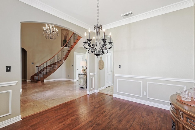 unfurnished dining area with hardwood / wood-style flooring and crown molding