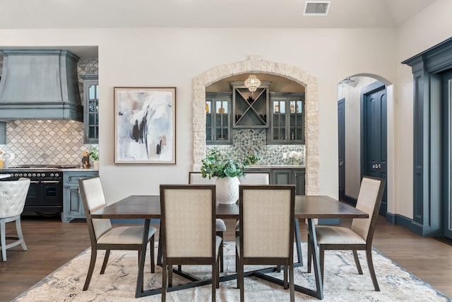 dining area featuring dark wood-type flooring