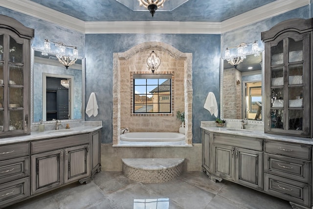 bathroom with tiled bath and vanity