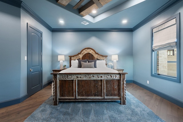 bedroom featuring dark wood-type flooring and crown molding