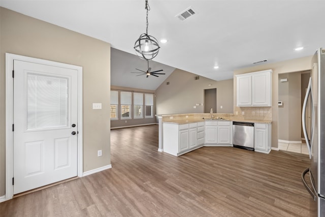 kitchen with appliances with stainless steel finishes, white cabinets, ceiling fan, kitchen peninsula, and light hardwood / wood-style flooring