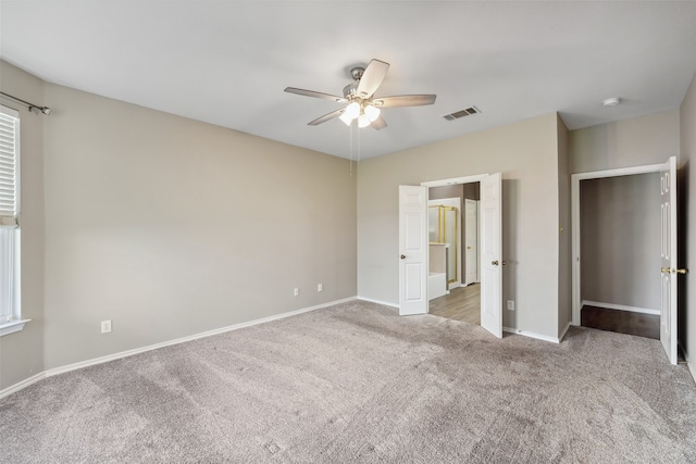 unfurnished bedroom featuring ceiling fan and carpet flooring