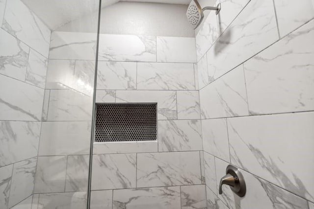 details featuring a tile shower