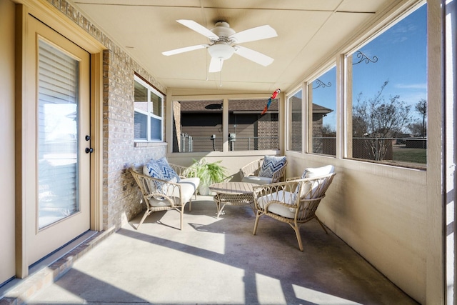 sunroom / solarium with ceiling fan